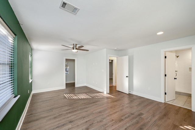 empty room featuring hardwood / wood-style flooring and ceiling fan