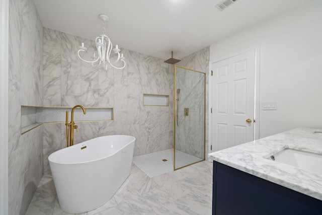 bathroom featuring vanity, an inviting chandelier, and shower with separate bathtub