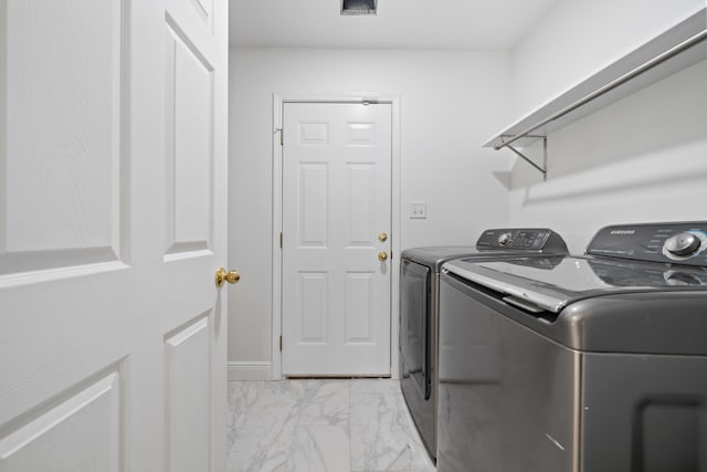 washroom featuring washer and dryer