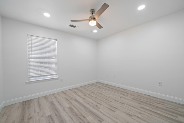 unfurnished room featuring ceiling fan and light wood-type flooring