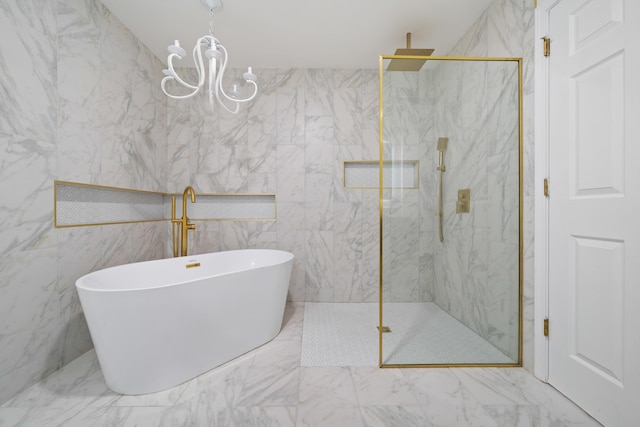 bathroom with separate shower and tub and a chandelier