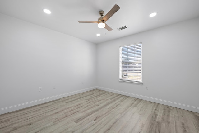 unfurnished room with ceiling fan and light hardwood / wood-style flooring