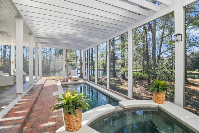 sunroom / solarium with a wealth of natural light and beam ceiling