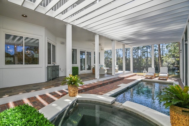 outdoor pool with a ceiling fan, french doors, a patio, and an in ground hot tub