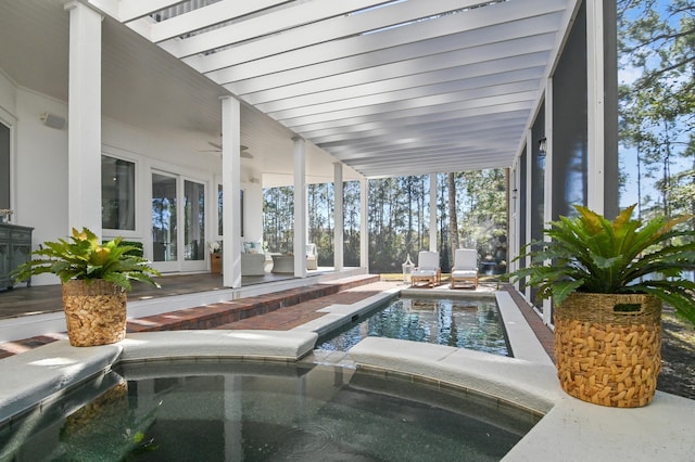 view of swimming pool with a ceiling fan, a patio area, french doors, and an indoor in ground hot tub