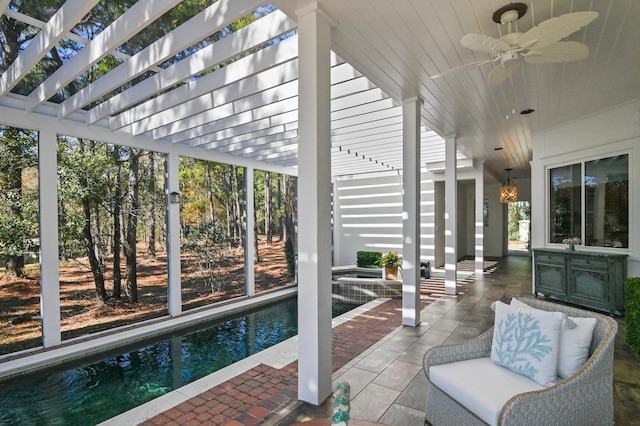 sunroom / solarium with ceiling fan and wooden ceiling