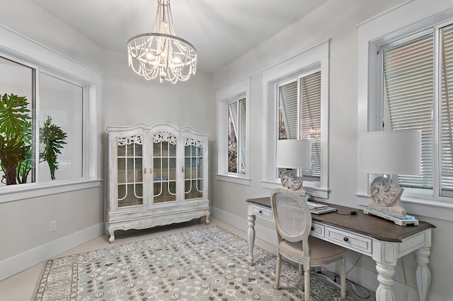 office area with a chandelier, a wealth of natural light, and baseboards