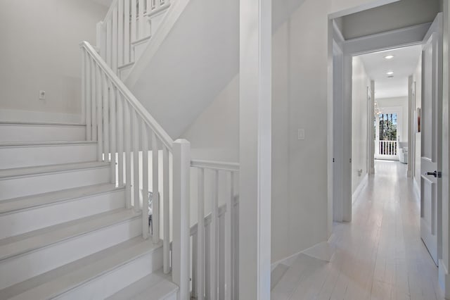 stairway with wood finished floors