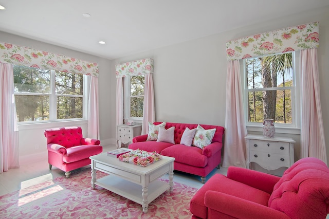 living area featuring recessed lighting and baseboards