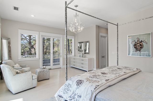 bedroom with access to exterior, visible vents, light wood-style floors, and an inviting chandelier