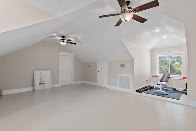 bonus room with lofted ceiling, visible vents, and light wood-style flooring