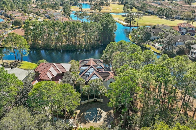 drone / aerial view featuring a residential view and a water view