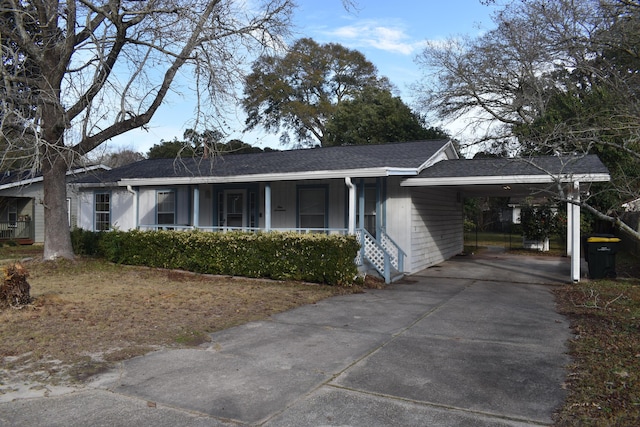 ranch-style home featuring a carport