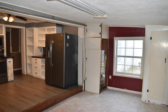 kitchen featuring ceiling fan, appliances with stainless steel finishes, and a textured ceiling