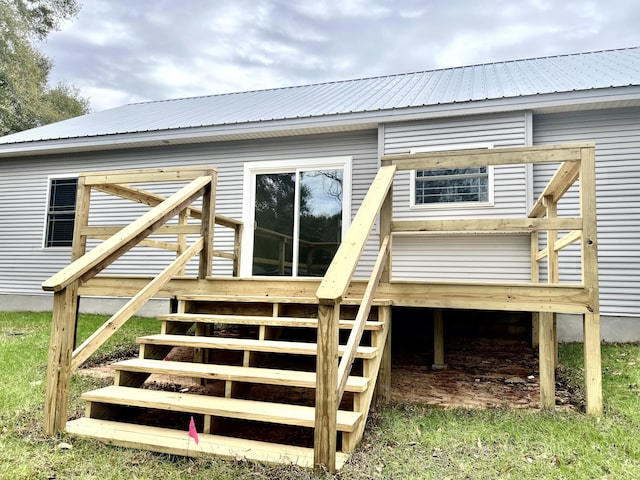 back of house featuring a wooden deck