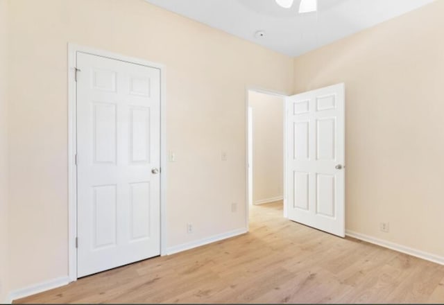 unfurnished bedroom featuring light wood-type flooring