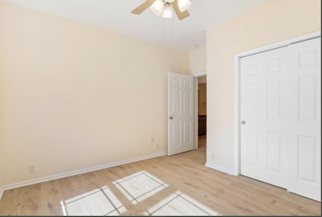 unfurnished bedroom featuring ceiling fan and light hardwood / wood-style flooring