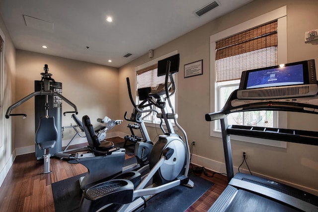 workout area featuring dark hardwood / wood-style floors