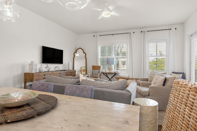 living room featuring plenty of natural light and ceiling fan