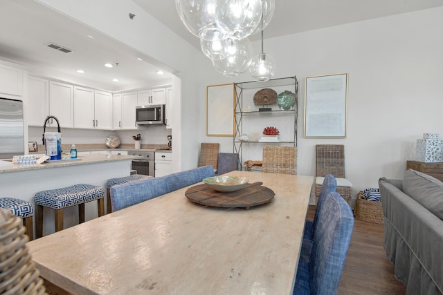 dining room featuring dark wood-type flooring