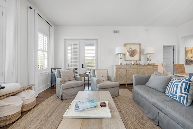 living room featuring wood-type flooring and french doors