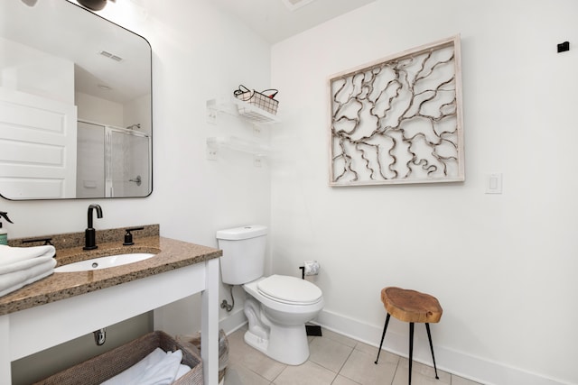 bathroom with walk in shower, toilet, tile patterned flooring, and sink