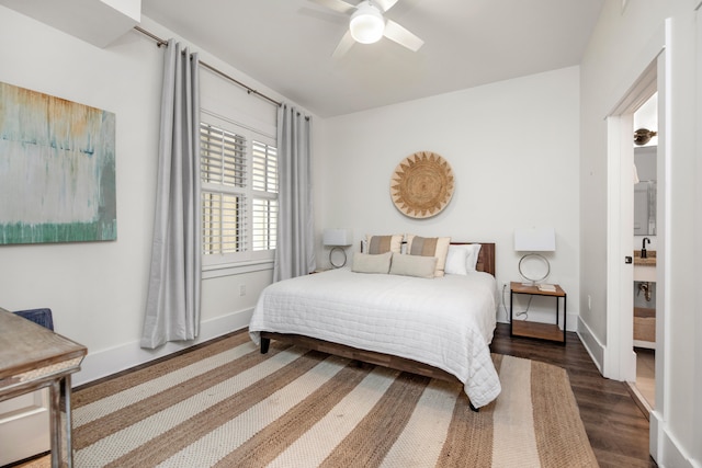 bedroom featuring dark hardwood / wood-style flooring and ceiling fan