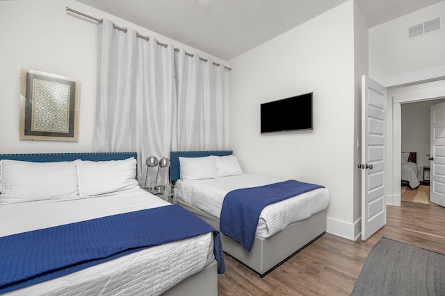 bedroom featuring hardwood / wood-style flooring