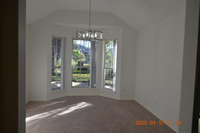 unfurnished dining area featuring vaulted ceiling, plenty of natural light, carpet floors, and a notable chandelier