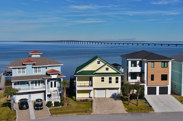 view of front of house with a water view and a garage