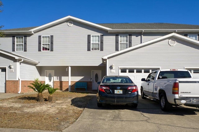 view of front of property with a garage