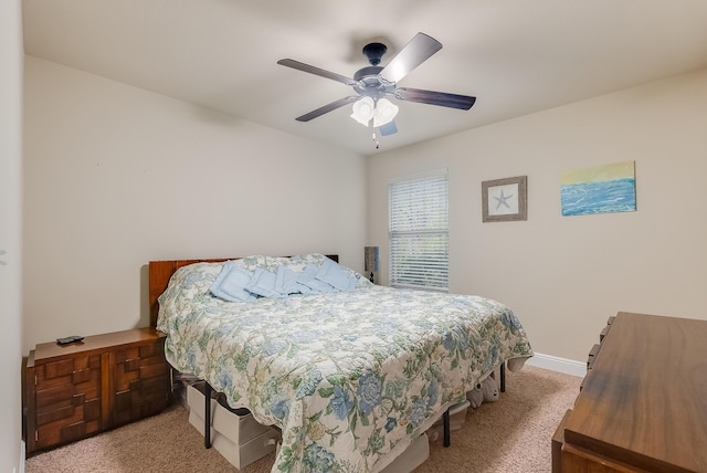 bedroom with ceiling fan and carpet floors