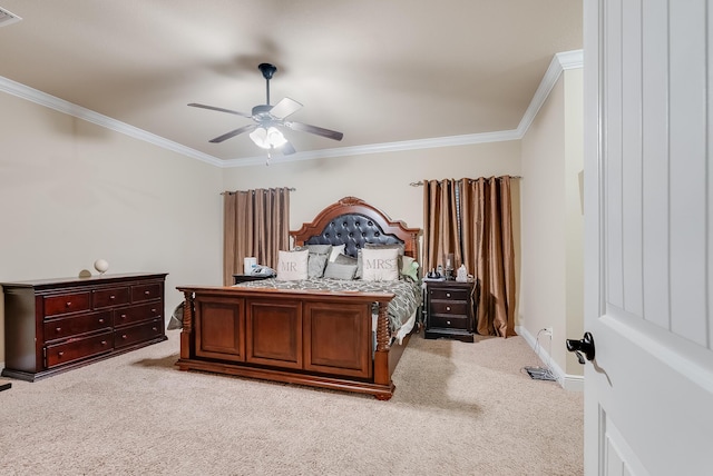 bedroom featuring ceiling fan, ornamental molding, and light colored carpet