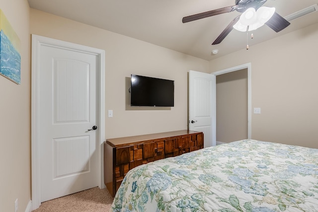 bedroom with ceiling fan and light colored carpet