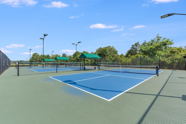 view of sport court with basketball hoop