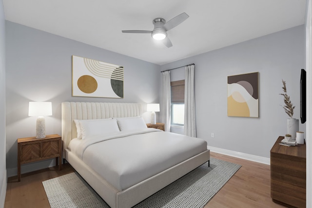 bedroom featuring ceiling fan and hardwood / wood-style flooring