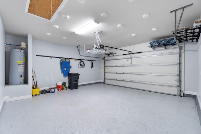 garage featuring water heater and a garage door opener