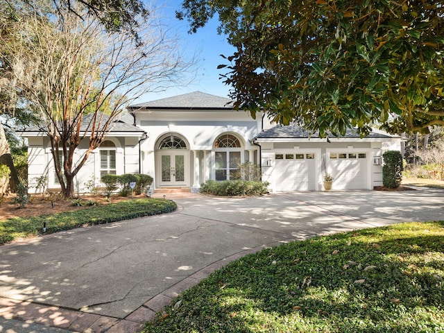 view of front of property with french doors and a garage