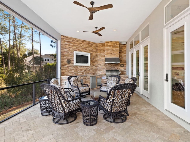 sunroom / solarium with ceiling fan