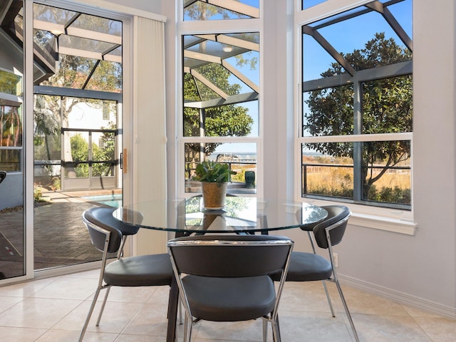 dining space featuring light tile patterned floors