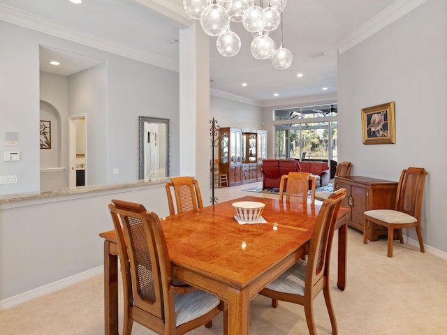 dining space featuring crown molding