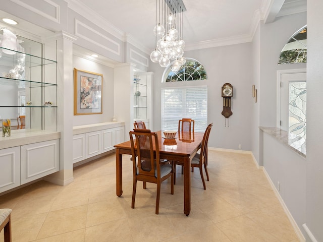 dining room with crown molding, light tile patterned floors, and a notable chandelier