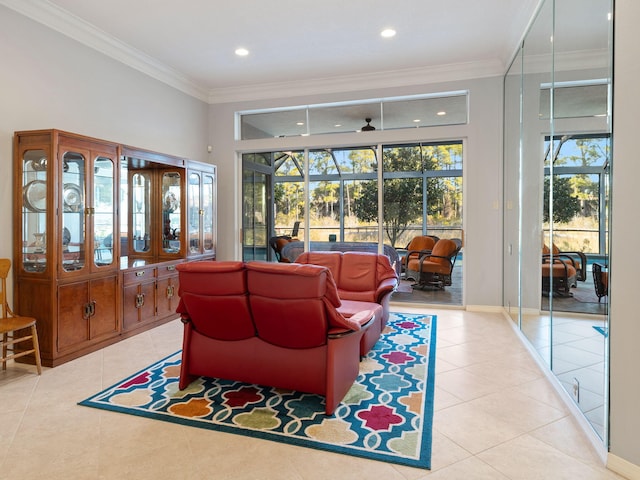 living room with light tile patterned floors, crown molding, a healthy amount of sunlight, and ceiling fan