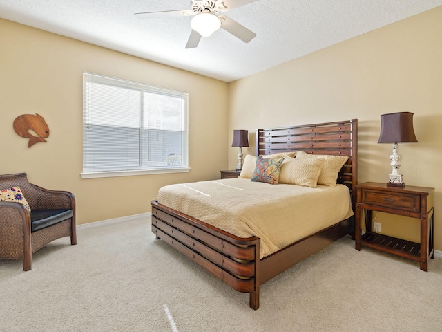 bedroom with light carpet and ceiling fan