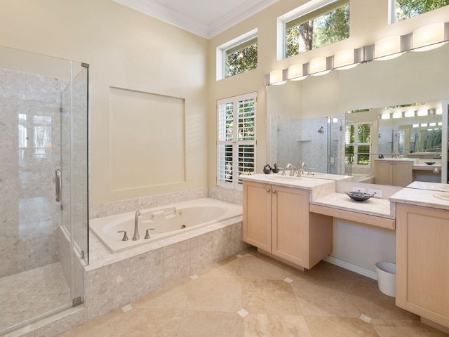 bathroom featuring crown molding, vanity, and shower with separate bathtub