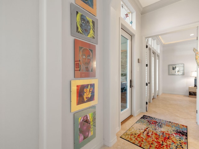 hall with light tile patterned floors and ornamental molding