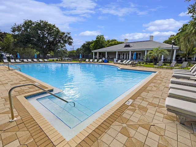 view of swimming pool with a patio