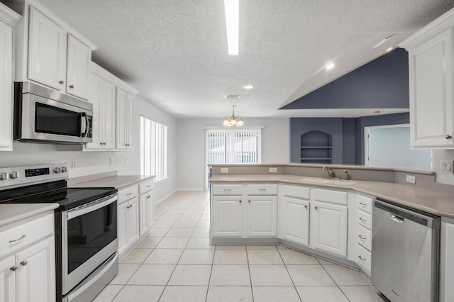 kitchen featuring white cabinetry, stainless steel appliances, and sink