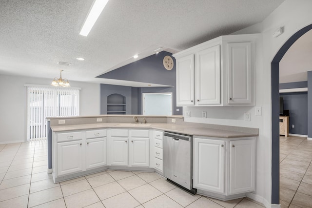 kitchen with hanging light fixtures, white cabinets, stainless steel dishwasher, sink, and kitchen peninsula