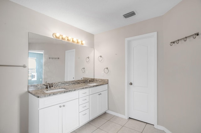 bathroom with vanity and tile patterned flooring